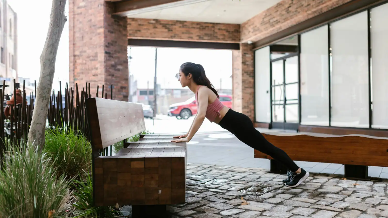 Woman doing outdoor workout in city park