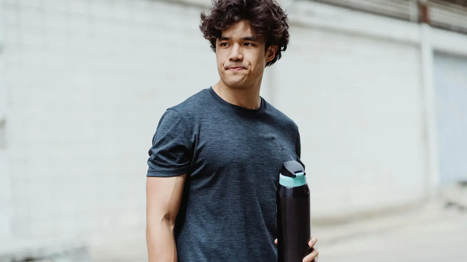 Man smiling outdoors casual fitness portrait