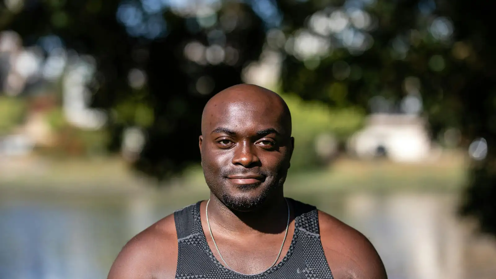 Person smiling outdoors casual fitness portrait