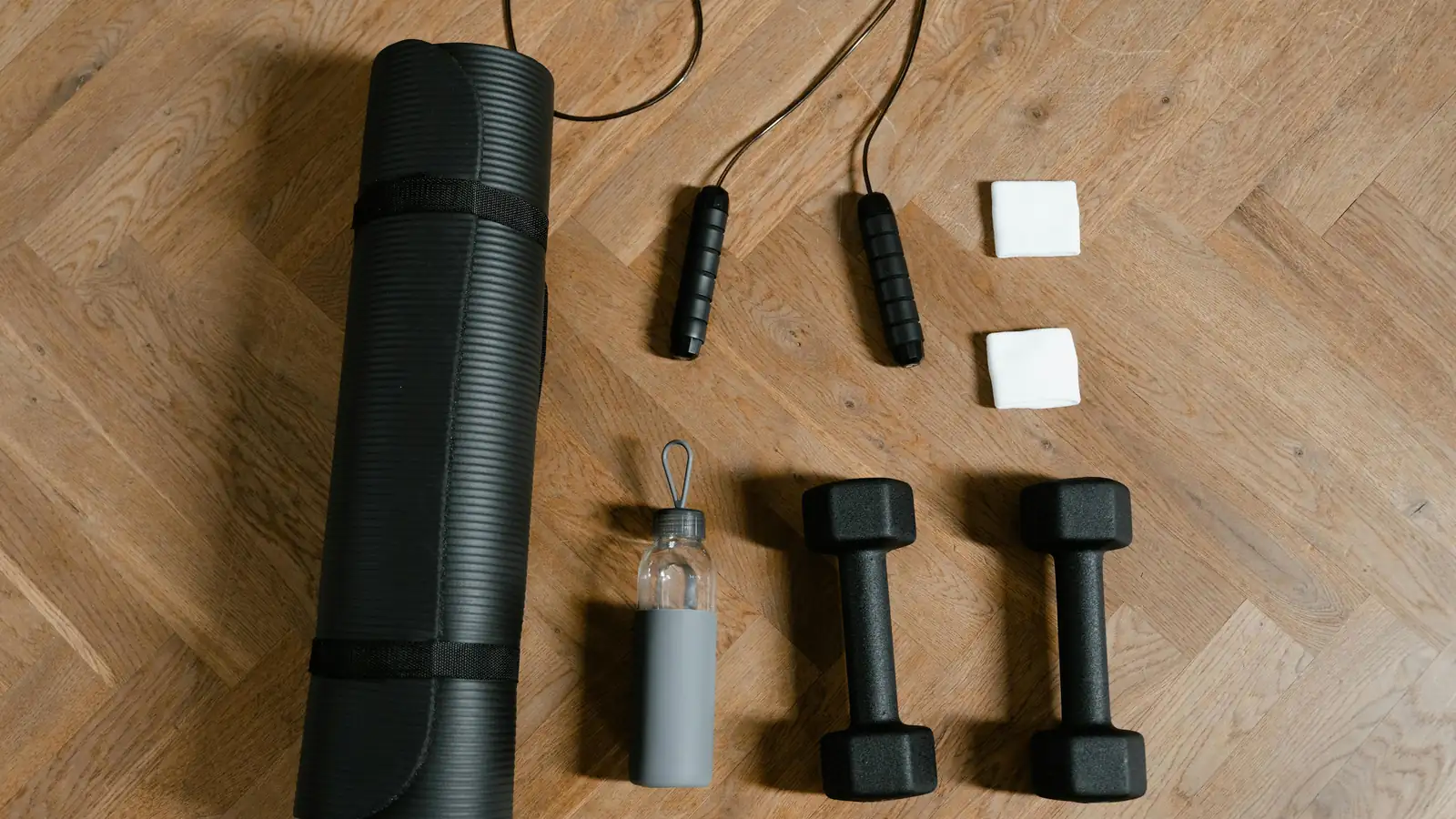 Minimal fitness equipment on a wooden floor